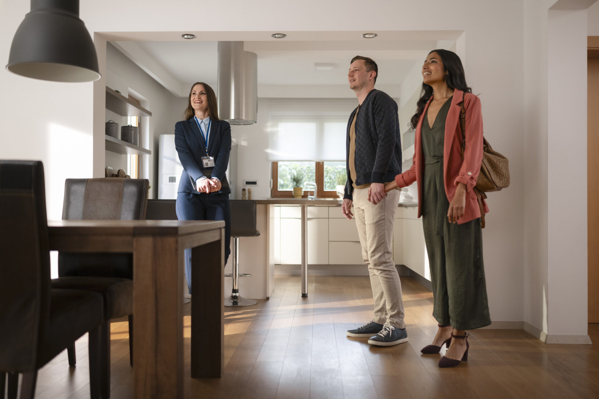 Real estate agent showing house to couple